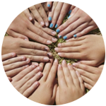 An image of hands in a circle